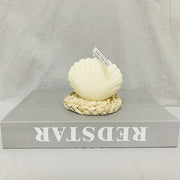White decorative item on a gray surface with 'REDSSTAR' branding.